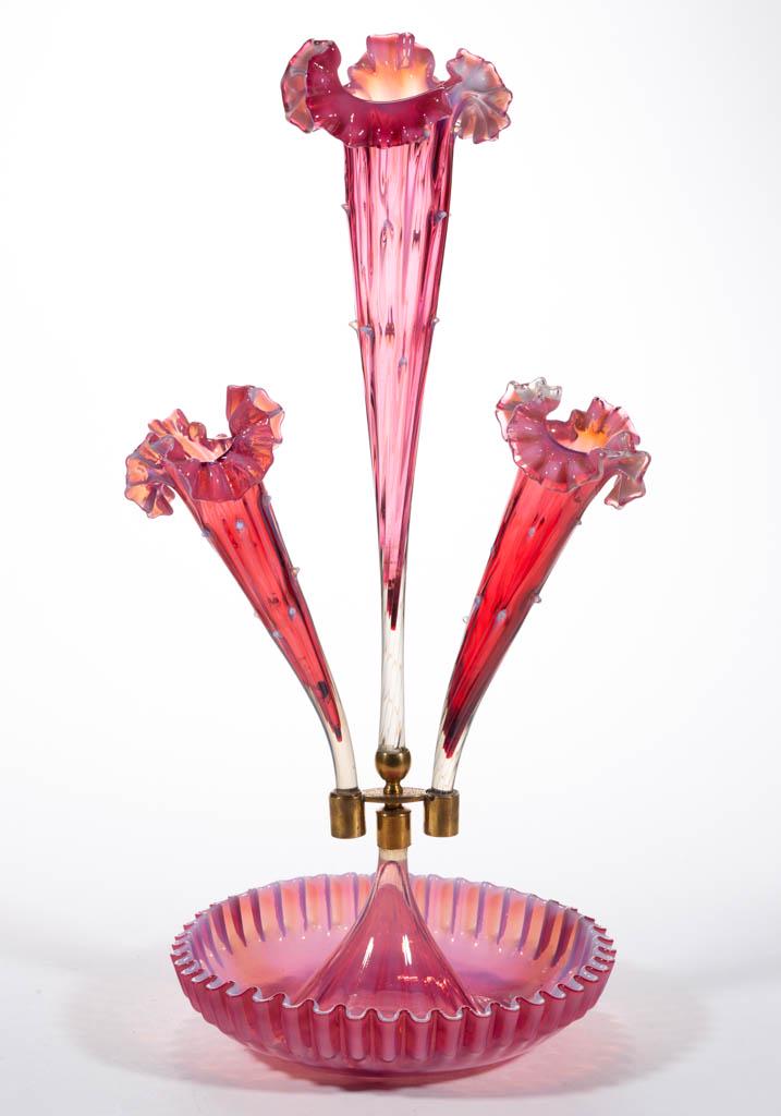 VICTORIAN OPALESCENT GLASS EPERGNE: VICTORIAN OPALESCENT GLASS EPERGNE, cranberry opalescent, ruffled base with a metal vase holder, three branch vases with ruffled rims and original metal mounts. Maker unverified. Late 19th/early 20th 