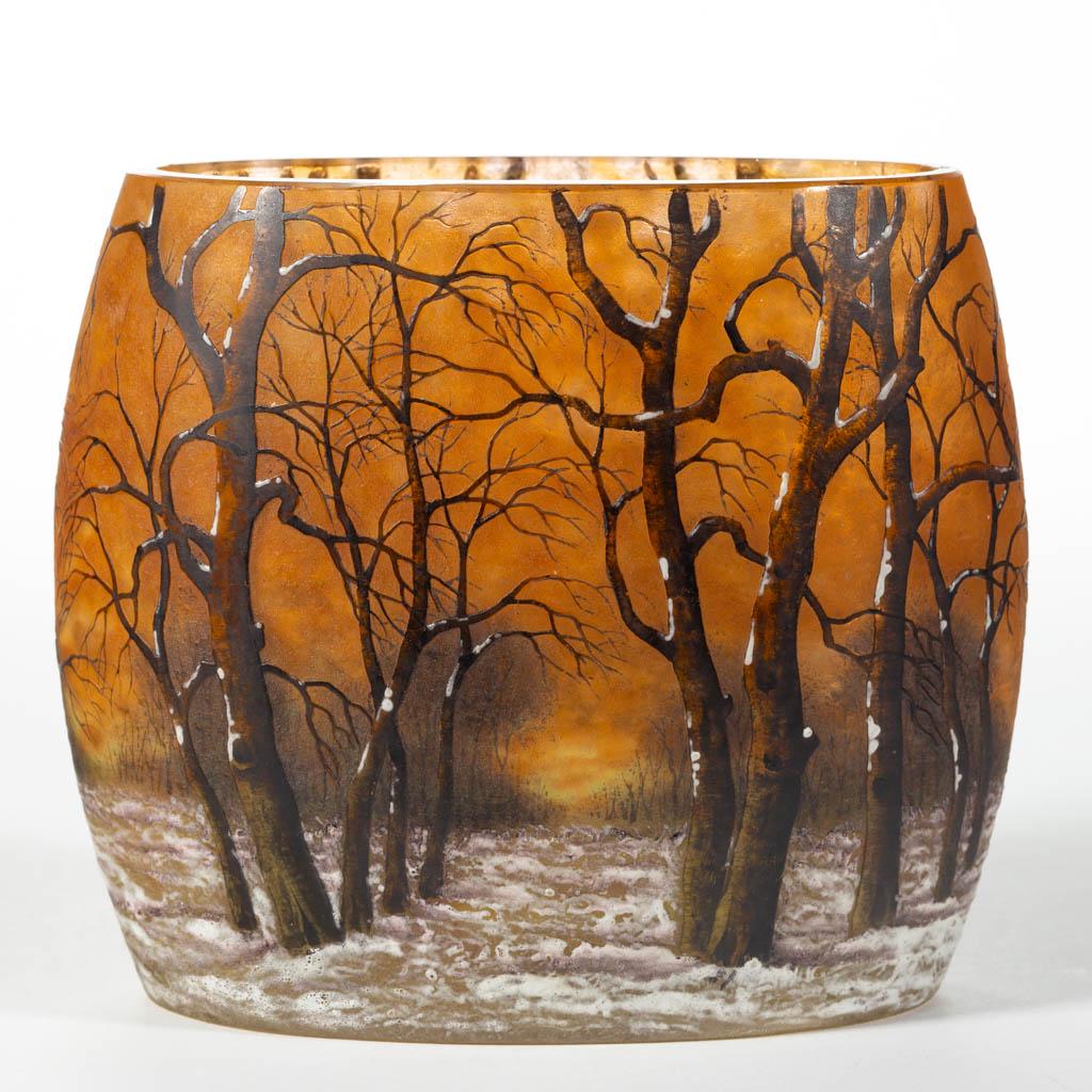 DAUM NANCY WINTER CAMEO PILLOW VASE: DAUM NANCY WINTER CAMEO PILLOW VASE, mottled amber ground with brown and white enamel decoration, oval form, factory-polished rim, polished pontil mark, signed "Daum/Nancy" with the cross of Lorraine.