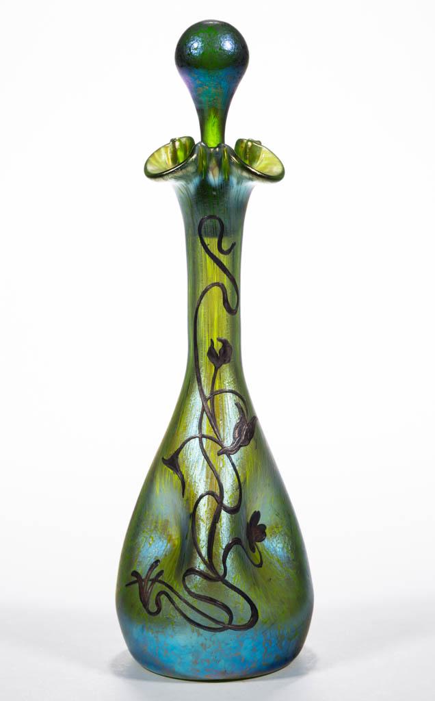 LOETZ CRETA PAPILLON SILVER-OVERLAY ART GLASS DECANTER: LOETZ CRETA PAPILLON SILVER-OVERLAY ART GLASS DECANTER, green iridescent, pinched form with a tooled rim, original stopper, floral and vine silver-overlay stamped "STERLING/SILVER", polished pontil ma