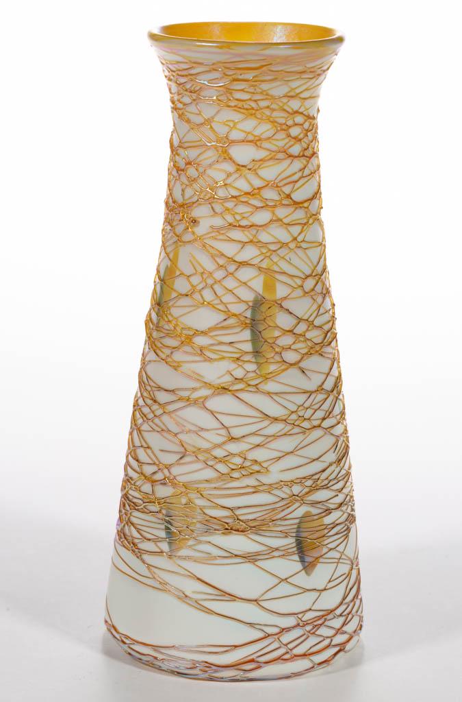 QUEZAL HEARTS ART GLASS VASE: QUEZAL HEARTS ART GLASS VASE, opal cased with a gold iridescent interior, green and golden decoration, tapered form with a slightly flaring rim, golden iridescent spider webbing, polished pontil mark 