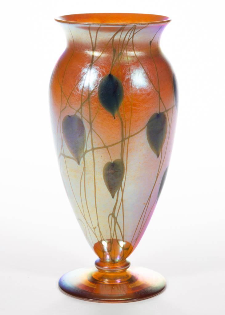 DURAND HEART AND VINE ART GLASS VASE: DURAND HEART AND VINE ART GLASS VASE, golden iridescent with green decoration, ovoid form with a flaring rim, applied circular foot, polished pontil mark signed "Durand V 20281 - 8". Vineland Flint Gl