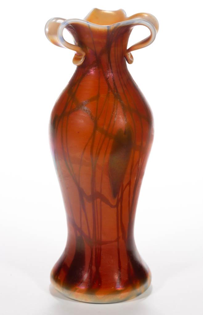 IMPERIAL FREE HAND HEART AND VINE ART GLASS VASE: IMPERIAL FREE HAND HEART AND VINE ART GLASS VASE, orange iridescent with blue decoration, Free Hand No. 248, cut and folded out tri-part rim, polished pontil mark, retains original paper label. Imperi