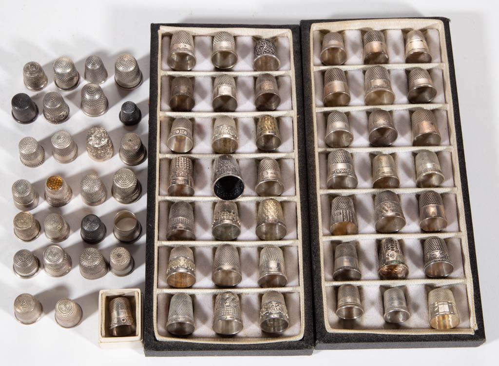ASSORTED STERLING SILVER AND OTHER THIMBLES, LOT OF 69: ASSORTED STERLING SILVER AND OTHER THIMBLES, LOT OF 69, comprising 37 marked sterling pieces, 13 marked English sterling pieces, a .935 silver piece, and 18 pieces of unmarked silver or other metal. T