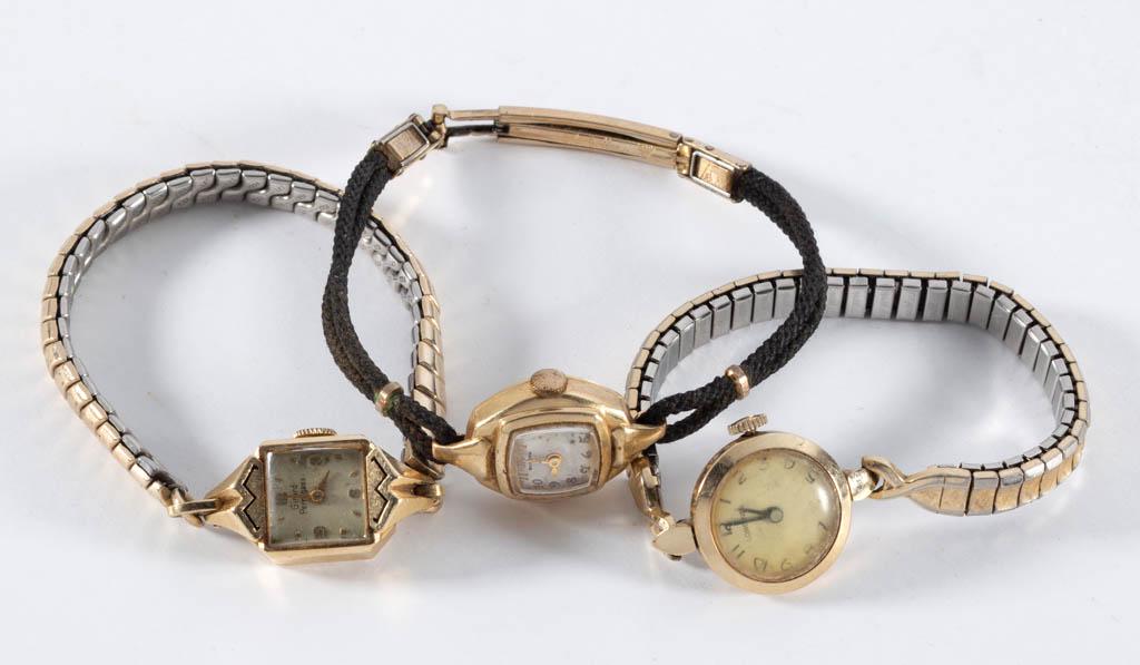 VINTAGE GOLD CASE LADY'S WRIST WATCHES, LOT OF THREE: VINTAGE GOLD CASE LADY'S WRIST WATCHES, LOT OF THREE, comprising a 14K Girard Perregaux; a 14K Bulova; and a 10K Longines. Each with band. 20th century. Various sizes. Good to very good condition. Not