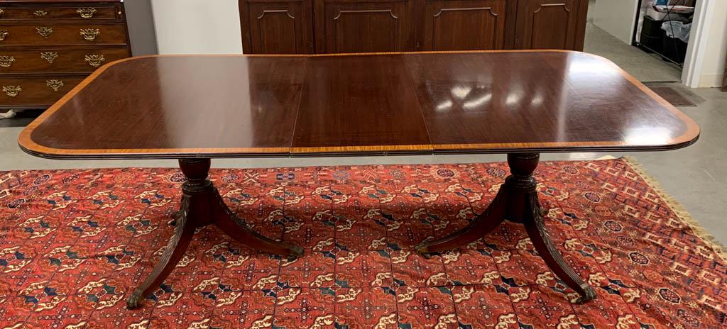 TWO-PART FEDERAL-STYLE MAHOGANY BANQUET TABLE: TWO-PART FEDERAL-STYLE MAHOGANY BANQUET TABLE, in the manner of Duncan Phyfe, each section having reeded-edge top with satinwood banding supported by a substantial turned standard on tripodal base wit