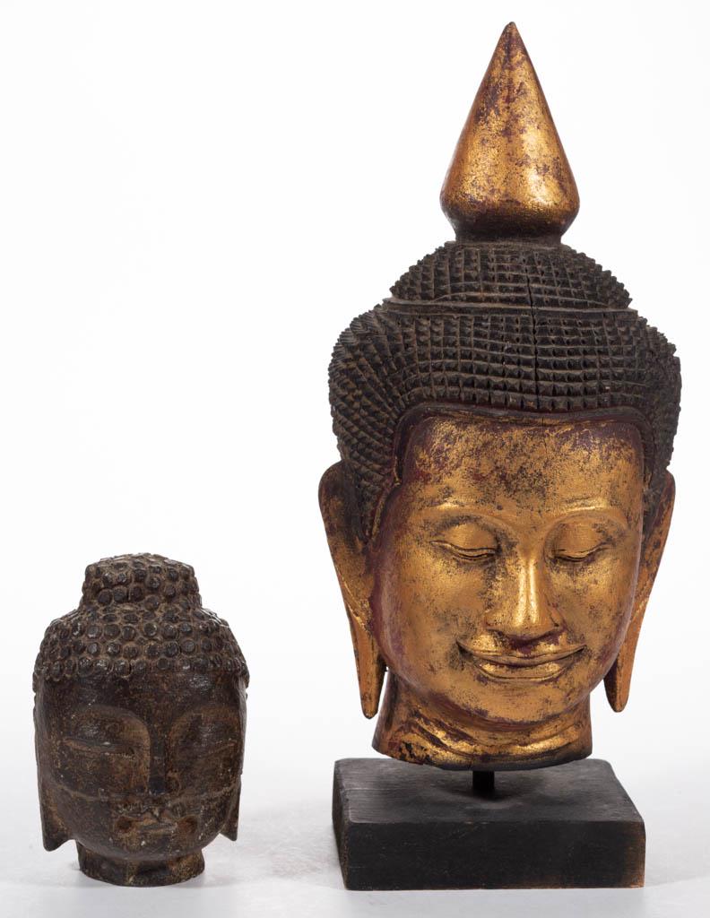 ASSORTED CHINESE BUDDHA BUSTS, LOT OF TWO: ASSORTED CHINESE BUDDHA BUSTS, LOT OF TWO, comprising a carved and gilt wooden example on a later base, and a carved stone example. Probably 20th century. 5" and 13 1/4" HOA.Very good overall visual c