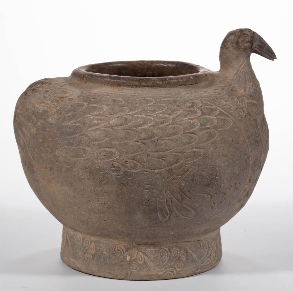 CHINESE EARTHENWARE FIGURAL JAR: CHINESE EARTHENWARE FIGURAL JAR, round form with bird-form shoulders featuring head and sgraffito designs to exterior, having a tapered base. Unmarked. A descriptive sheet from Arch Angel Antiques, Ho