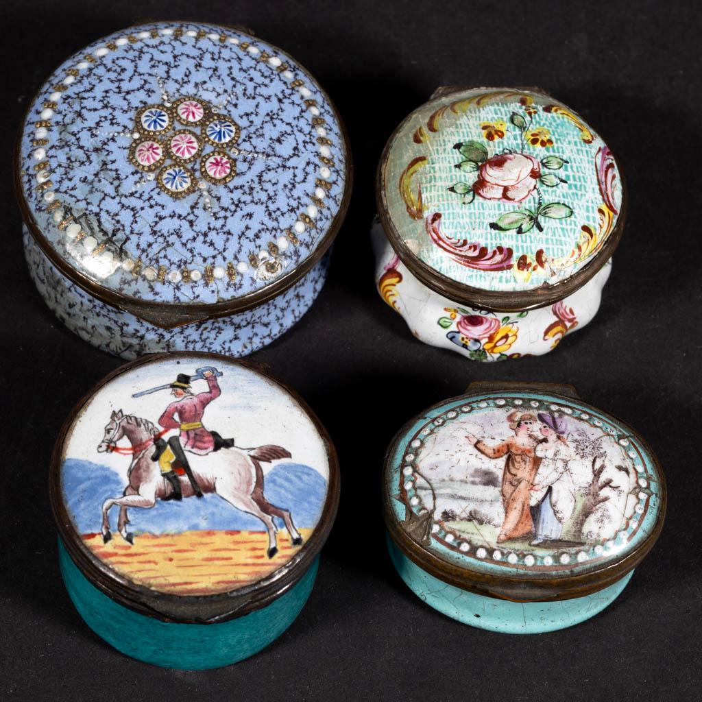 BATTERSEA / BILSTON ENAMEL SNUFF / PILL BOXES, LOT OF: BATTERSEA / BILSTON ENAMEL SNUFF / PILL BOXES, LOT OF FOUR, each having hinged lid with polychrome hand-painted decoration, comprising one oval example featuring two women walking in conversation with