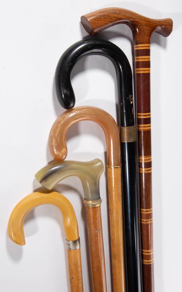 ASSORTED VINTAGE CANES / WALKING STICKS, LOT OF FIVE: ASSORTED VINTAGE CANES / WALKING STICKS, LOT OF FIVE, including an example with Bakelite handle and marked sterling collar bearing "HAIL CHIEF" inscription, and another example with thin gilt-metal co