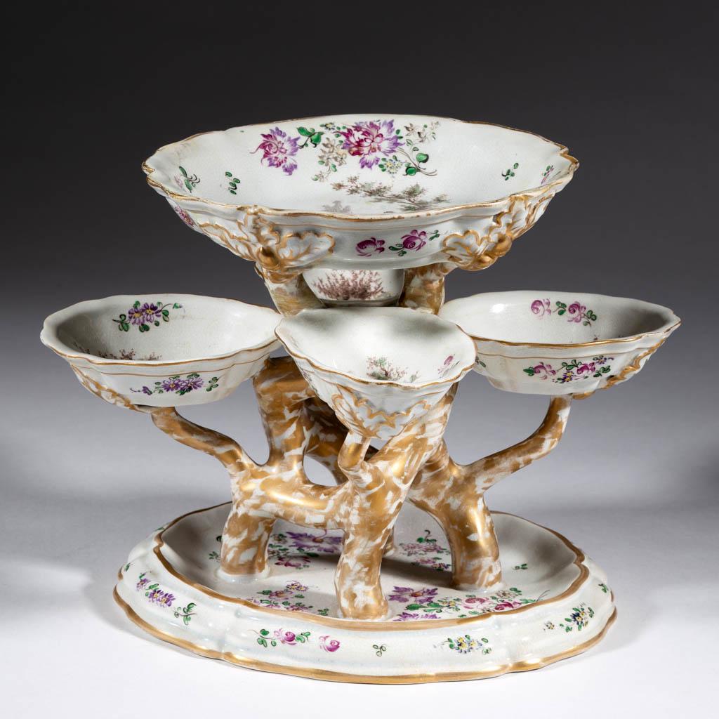 CONTINENTAL HAND-PAINTED CERAMIC CENTERPIECE / EPERGNE: CONTINENTAL HAND-PAINTED CERAMIC CENTERPIECE / EPERGNE, having four "tree" trunks spreading into branches holding five oval bowls with molded oak leaf and acorn decoration, each featuring central poly