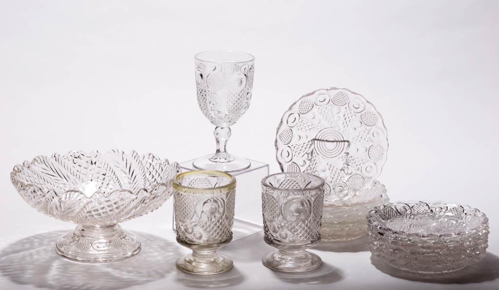 HORN OF PLENTY / COMET (OMN) ARTICLES, LOT OF 16: HORN OF PLENTY / COMET (OMN) ARTICLES, LOT OF 16, colorless lead glass, comprising a goblet, two spooners with one having remnants of staining to the rim, and 13 plates. Together with a colorless Swir