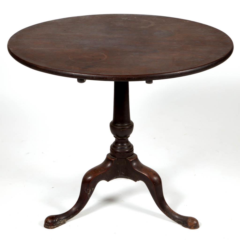 EASTERN VIRGINIA WALNUT TILT-TOP TEA TABLE: EASTERN VIRGINIA WALNUT TILT-TOP TEA TABLE, circular one-board top over a robustly turned standard raised on tripodal base with cabriole legs ending in padded feet with slightly peaked profile. Retain