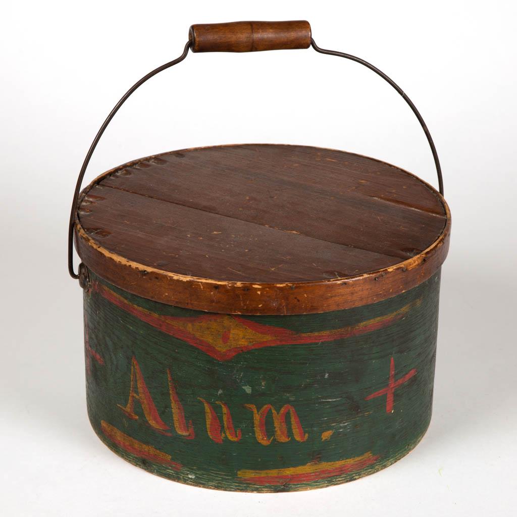 AMERICAN PAINT-DECORATED BENTWOOD PANTRY BOX: AMERICAN PAINT-DECORATED BENTWOOD PANTRY BOX, covered circular form, lapped construction, with bail handle. Retaining likely original green-painted surface with free-hand decoration in red and yellow,
