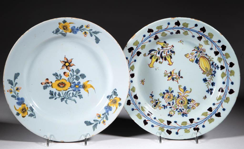 ENGLISH DELFT TIN-GLAZED EARTHENWARE PLATES, LOT OF TWO: ENGLISH DELFT TIN-GLAZED EARTHENWARE PLATES, LOT OF TWO, each having bright polychrome hand-painted floral motif, one having a vine and berry border decoration and one with border design featuring thr