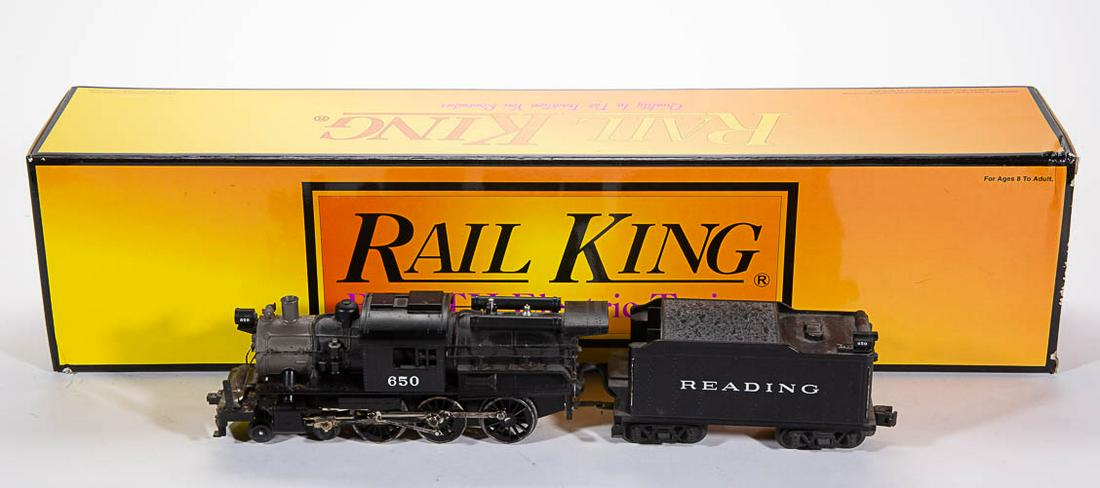 M.T.H. / RAIL KING READING O-GAUGE LOCOMOTIVE WITH: M.T.H. / RAIL KING READING O-GAUGE LOCOMOTIVE WITH TENDER, Camelback, 4-6-0 wheel configuration, cab 650. Original box. Fourth quarter 20th century. Locomotive 11" LOA.Very good overall condition with