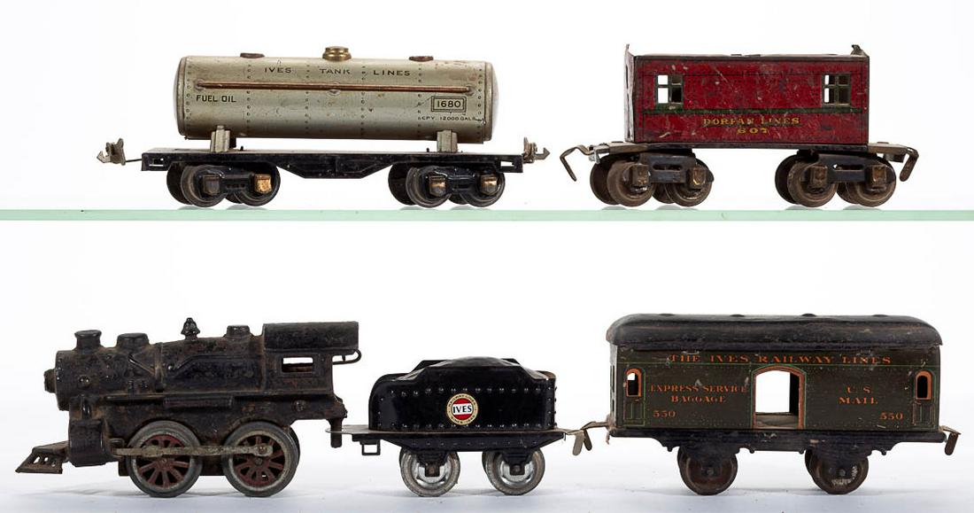 ASSEMBLED O-GAUGE TRAIN SET, LOT OF FIVE: ASSEMBLED O-GAUGE TRAIN SET, LOT OF FIVE, comprising an unmarked engine, an Ives tender, a No. 1680 Ives tanker, an Ives No. 550 U.S. Mail car, and a Dorfan Lines No. 607 caboose. Circa 1929. Engine 6