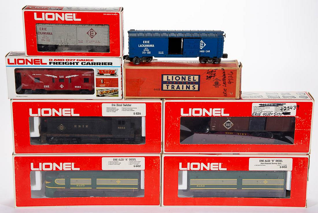 LIONEL O-GAUGE ERIE LOCOMOTIVE AND CARS, LOT OF NINE: LIONEL O-GAUGE ERIE LOCOMOTIVE AND CARS, LOT OF NINE, comprising a No. 8452 diesel locomotive, a No. 8453 diesel dummy, a No. 8354 diesel switcher, and six various Erie/Erie-Lackawanna freight cars (u