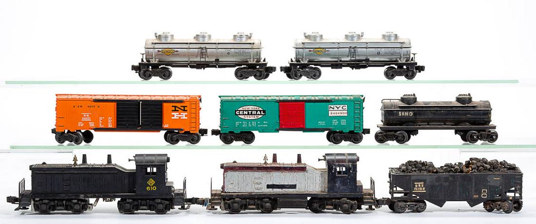 LIONEL O-GAUGE DIESEL SWITCHERS AND FREIGHT CARS, LOT: LIONEL O-GAUGE DIESEL SWITCHERS AND FREIGHT CARS, LOT OF 16, comprising two diesel switchers including a No. 610 Erie example and 14 various freight cars including a No. 6464-900 box car, two Sunoco o