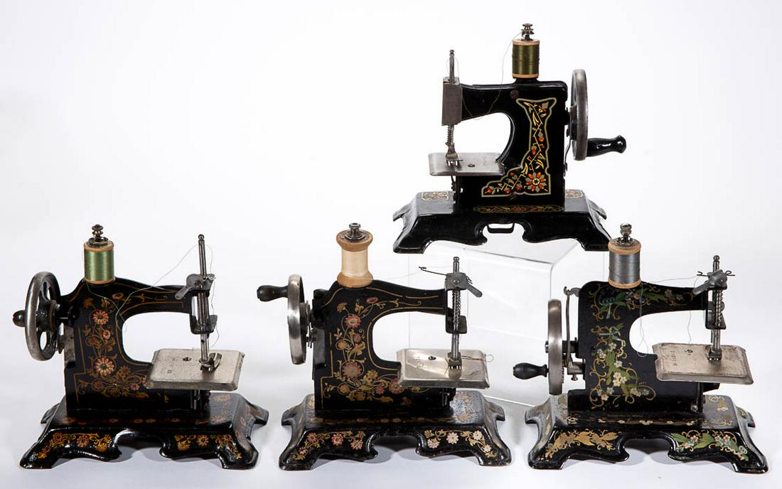 GERMAN METAL CHILD'S TOY SEWING MACHINES, LOT OF FOUR: GERMAN METAL CHILD'S TOY SEWING MACHINES, LOT OF FOUR, each with stenciled floral decoration. Each with "Made in Germany" mark, many or all likely by F.W. Muller of Berlin. First half 20th century. 7"