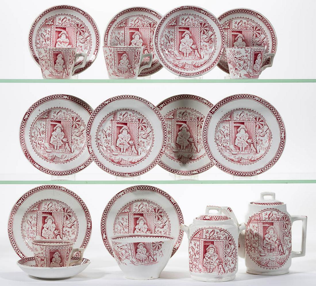 ENGLISH STAFFORDSHIRE "LITTLE MAE" CERAMIC CHILDREN: ENGLISH STAFFORDSHIRE "LITTLE MAE" CERAMIC CHILDREN'S TOY 18-PIECE TEA SET, comprising a teapot, a covered sugar, a 4" D waste bowl, four cups, five saucers, and six 5 1/4" D plates, each having red/p
