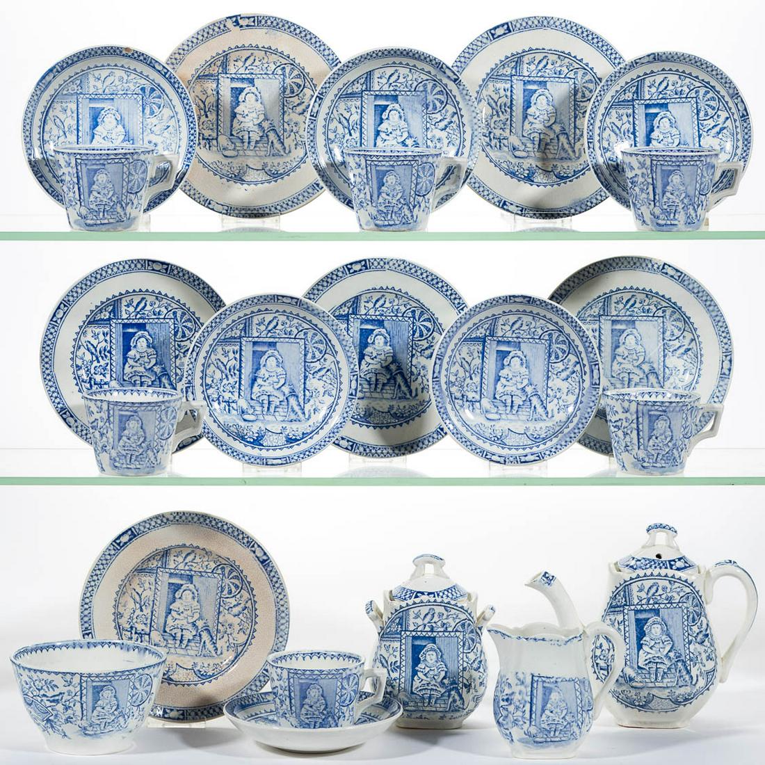 ENGLISH STAFFORDSHIRE "LITTLE MAE" CERAMIC CHILDREN: ENGLISH STAFFORDSHIRE "LITTLE MAE" CERAMIC CHILDREN'S TOY 22-PIECE TEA SET, comprising a teapot, a covered sugar, a creamer, a 3 7/8" D waste bowl, six cup and saucer sets, and six 5 3/8" D plates, ea
