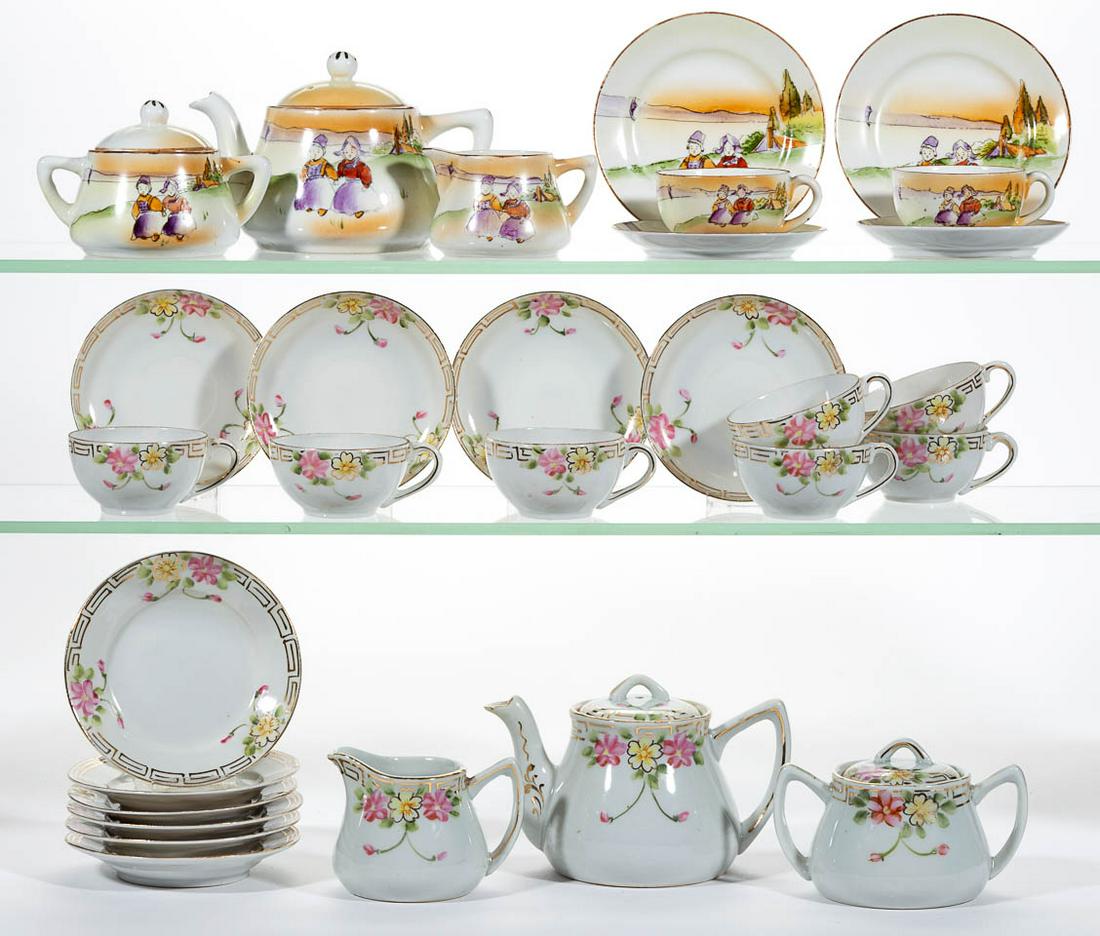 JAPANESE NIPPON PORCELAIN HAND-PAINTED CHILDREN: JAPANESE NIPPON PORCELAIN HAND-PAINTED CHILDREN'S TOY TEA AND TABLE SETS, LOT OF FOUR, comprising a four-piece condiment set having a circular open-handled cake plate, a covered mustard, and a salt an