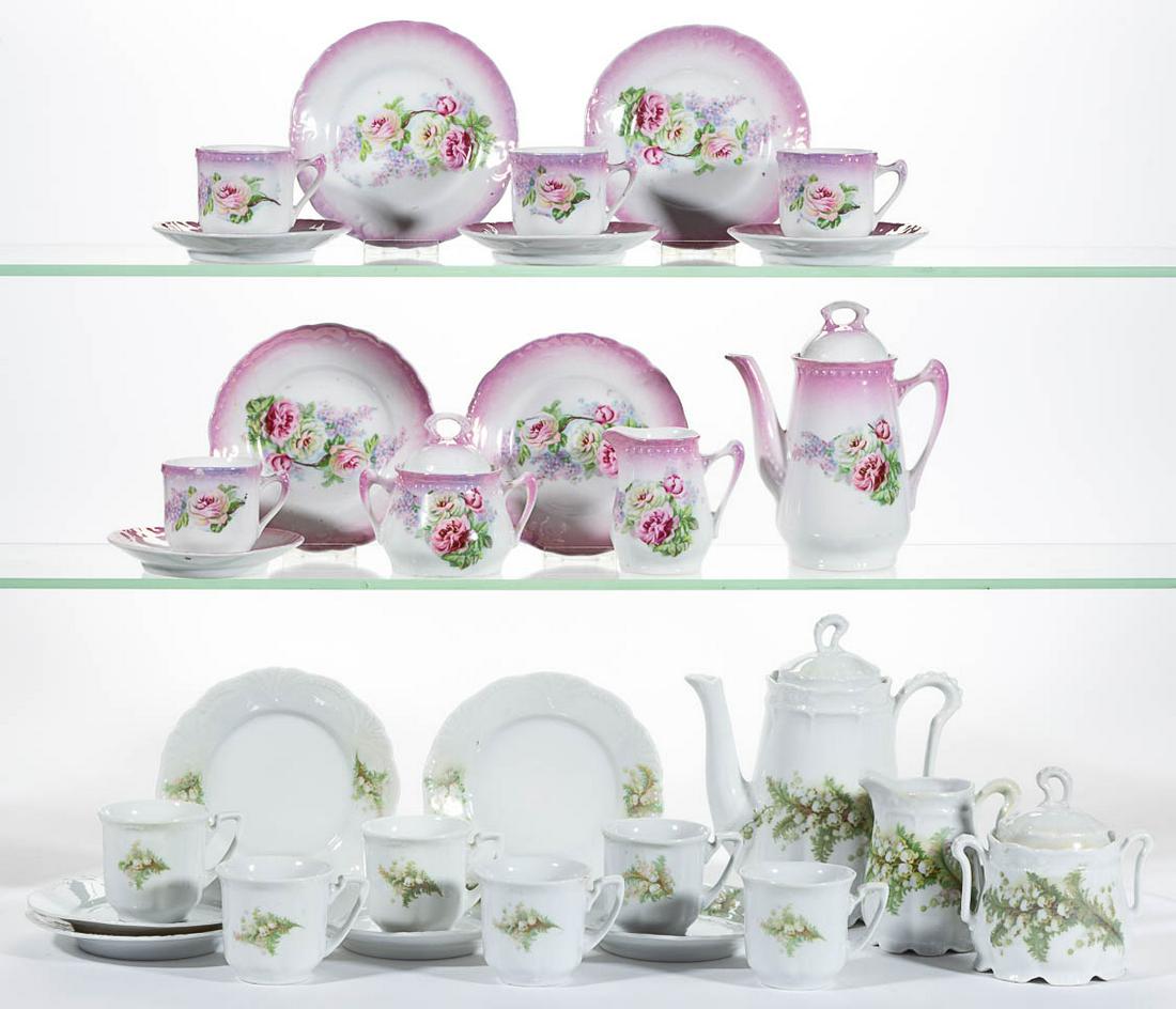 GERMAN PORCELAIN FLORAL MOTIF CHILDREN: GERMAN PORCELAIN FLORAL MOTIF CHILDREN'S TOY 15-PIECE TEA SETS, LOT OF TWO, comprising one set including a teapot, a covered sugar, a creamer, and six cup and saucer sets, each featuring beautiful lil