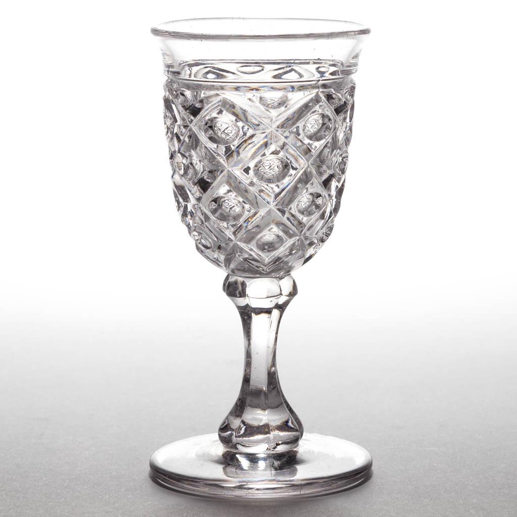 DIAMOND THUMBPRINT WINE: DIAMOND THUMBPRINT WINE, colorless lead glass, plain base. Boston & Sandwich Glass Co. and others. 1850-1870. 4 1/4" H, 2" D rim, 2 1/8" D base. Undamaged. Provenance: From the Jim & Sandra Hirzel col