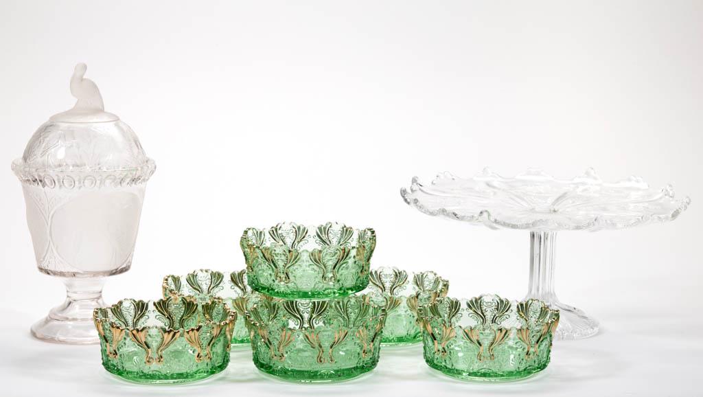ASSORTED EAPG ARTICLES, LOT OF EIGHT: ASSORTED EAPG ARTICLES, LOT OF EIGHT, colorless and green, comprising six Idyll sauce dishes, a Frosted Stork covered sugar bowl, and a Thistle cake stand. Various makers. Fourth quarter 19th/first qu