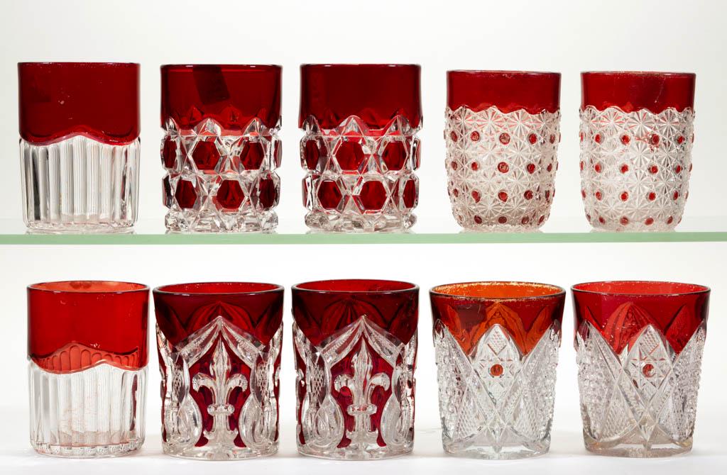 ASSORTED EAPG - RUBY-STAINED TUMBLERS, FIVE PAIRS: ASSORTED EAPG - RUBY-STAINED TUMBLERS, FIVE PAIRS, colorless, including a Higbee's Fleur-De-Lis pair, a Red Block pair, and a Daisy & Button pair. Late 19th/first quarter 20th century. 3 1/2" to 3 3/4