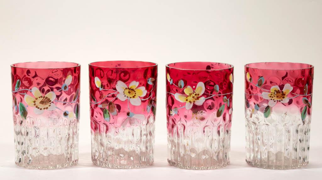 SPOT-OPTIC LOW VERTICAL RIB RUBINA GLASS TUMBLERS, SET: SPOT-OPTIC LOW VERTICAL RIB RUBINA GLASS TUMBLERS, SET OF FOUR, rubina, each with floral enamel decoration and polished rim. Late 19th/early 20th century. 4" H. Each with one or a few minor spots of p