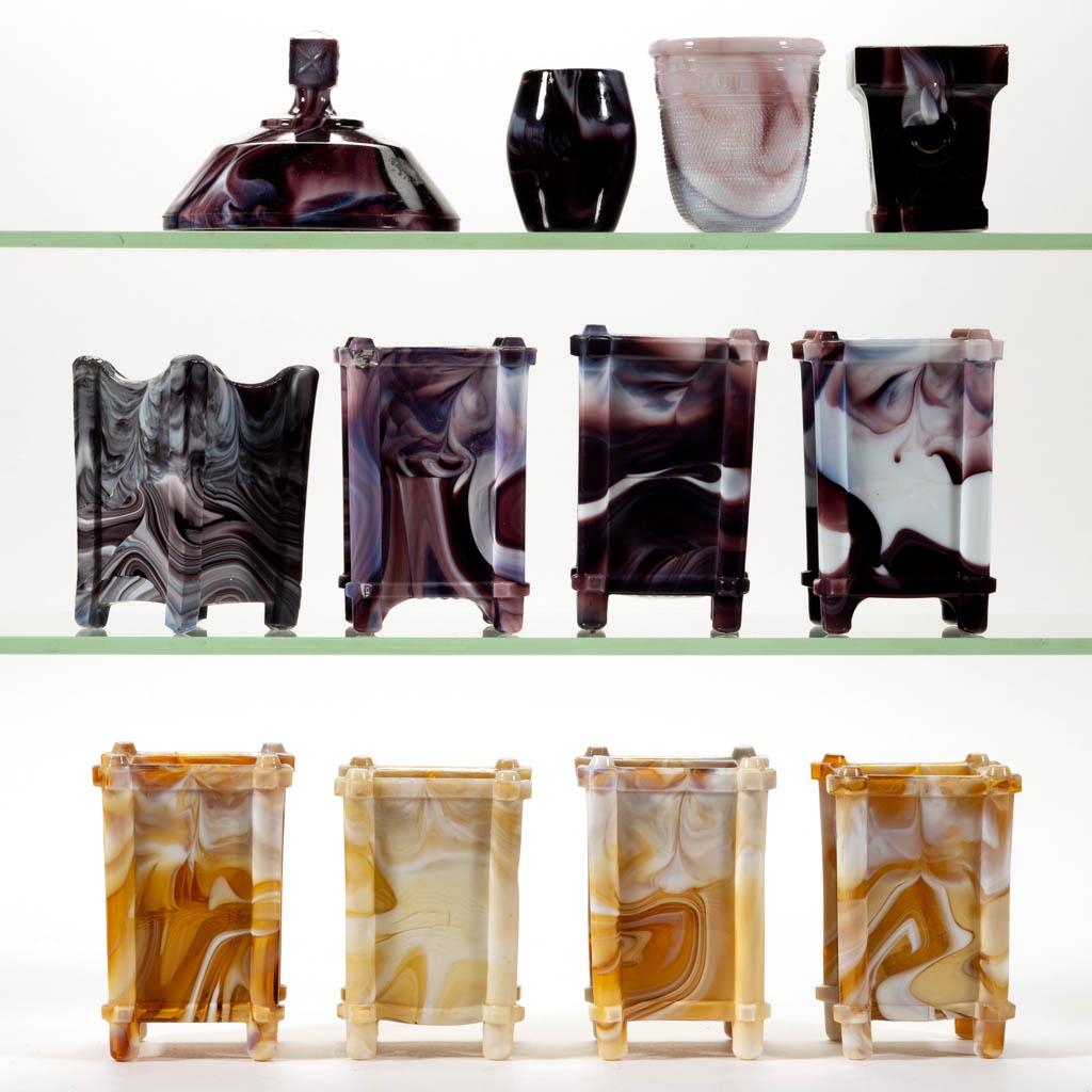 ASSORTED SLAG GLASS ARTICLES, LOT OF 12: ASSORTED SLAG GLASS ARTICLES, LOT OF 12, amber and purple slag, including eight match holders, a thimble-form toothpick holder, and a barrel-form toothpick holder. Various makers. Fourth quarter 19th