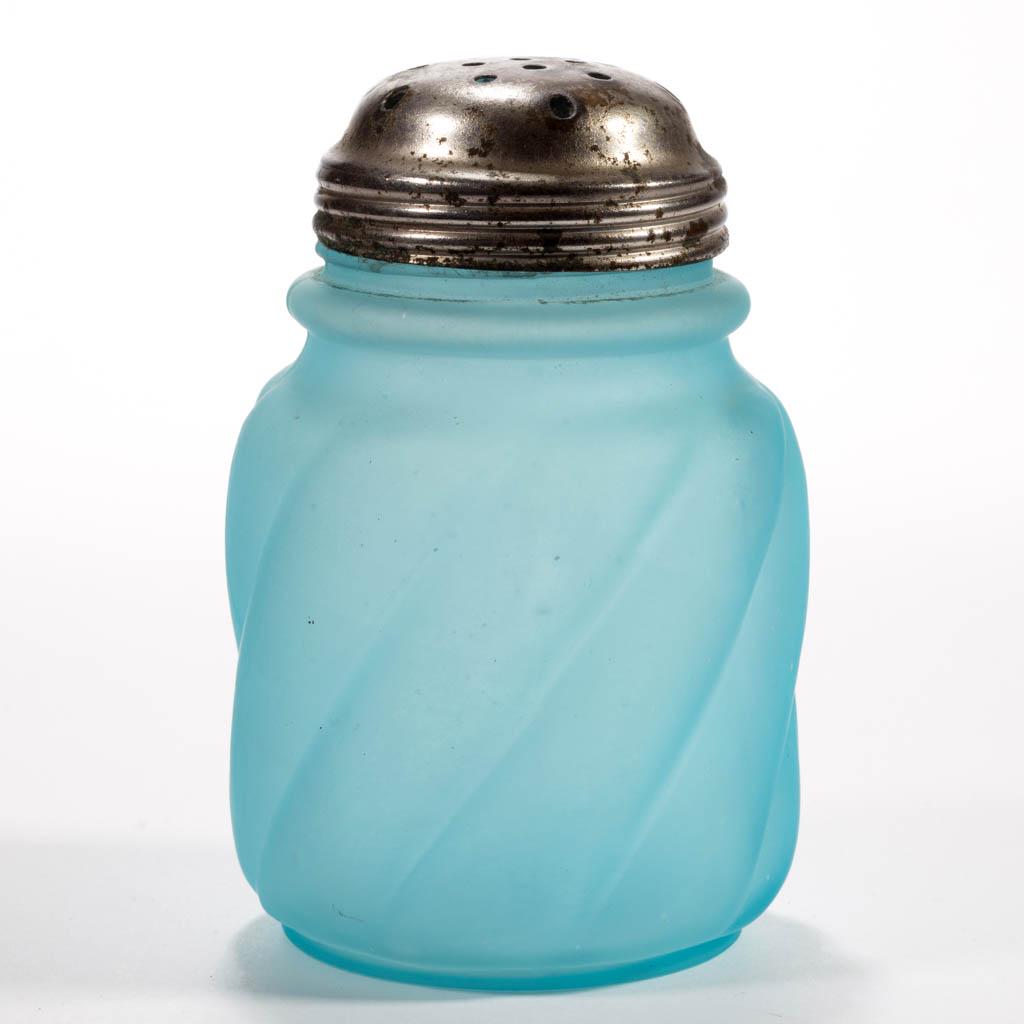 PARIAN SWIRL SUGAR SHAKER: PARIAN SWIRL SUGAR SHAKER, blue with a satin finish, period lid. The Northwood Glass Co. Circa 1894. 4 3/4" H. Undamaged with the lid having wear. Expected roughness to the mouth, as made. Literature: