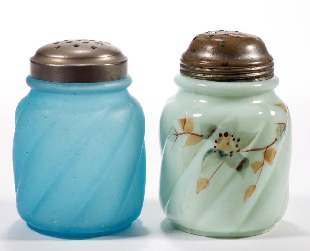 PARIAN SWIRL SUGAR SHAKERS, LOT OF TWO: PARIAN SWIRL SUGAR SHAKERS, LOT OF TWO, opaque green and frosted blue, green having polychrome-enamel decoration, period lids. Northwood Glass Co. Pattern introduced 1895. 4 3/8" and 4 1/2" H. Undamag