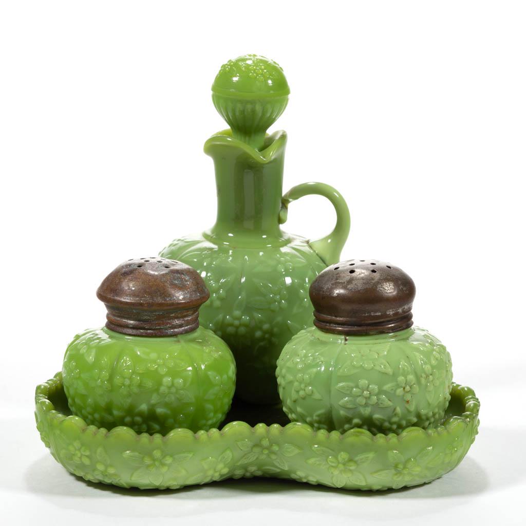 CHALLINOR FORGET-ME-NOT FOUR-PIECE CONDIMENT SET: CHALLINOR FORGET-ME-NOT FOUR-PIECE CONDIMENT SET, opaque green, comprising a cruet with correct stopper, salt and pepper shaker with period lids, and a lobed tray. Challinor, Taylor & Co. Pattern intr