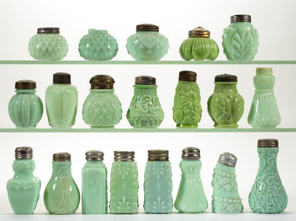 ASSORTED OPAQUE SALT AND PEPPER SHAKERS, LOT OF 20: ASSORTED OPAQUE SALT AND PEPPER SHAKERS, LOT OF 20, opaque green, including Ribbon Band, Cord and Tassle, and Leaf Palm example, 18 having a period lid. Various makers. Late 19th/first quarter 20th ce