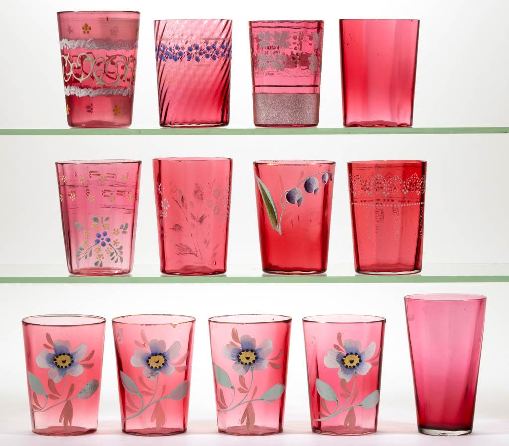 ASSORTED CRANBERRY GLASS TUMBLERS, LOT OF 13: ASSORTED CRANBERRY GLASS TUMBLERS, LOT OF 13, cranberry, most with enamel decoration, including several Panel-Optic examples and a Swirl-Optic. Late 19th/early 20th century. 3 3/4" to 4 3/4" H. Most w
