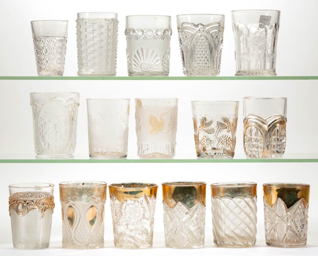 ASSORTED TUMBLERS, LOT OF 15: ASSORTED TUMBLERS, LOT OF 15, colorless, some with gilt decoration, including an etched example featuring windmill, an Oriental Poppy, a Carnation, and a New Jersey. Together with a colorless Daisy an