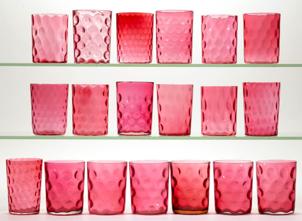 ASSORTED CRANBERRY OPTIC GLASS TUMBLERS, LOT OF 19: ASSORTED CRANBERRY OPTIC GLASS TUMBLERS, LOT OF 19, cranberry, including various Spot-Optic and Honeycomb-Optic examples. Most late 19th/early 20th century. 3 1/2" to 3 7/8" HOA. Some pieces with one 