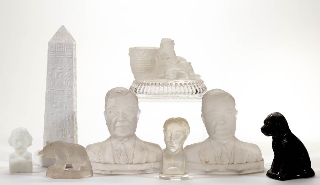 ASSORTED PRESSED NOVELTY ARTICLES, LOT OF EIGHT: ASSORTED PRESSED NOVELTY ARTICLES, LOT OF EIGHT, frosted colorless, opaque white, and opaque black, including two "M. J. OWENS" paperweights, an Egyptian Obelisk, and a dog and bear figurine. Various