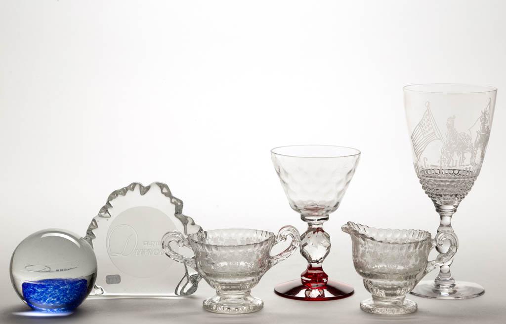 ASSORTED GLASS ARTICLES, LOT OF SIX: ASSORTED GLASS ARTICLES, LOT OF SIX, colorless, including two Duncan paperweights, and four Depression-era articles including a Michael Kroll "The Meadows" goblet. Various makers. First half 20th cent