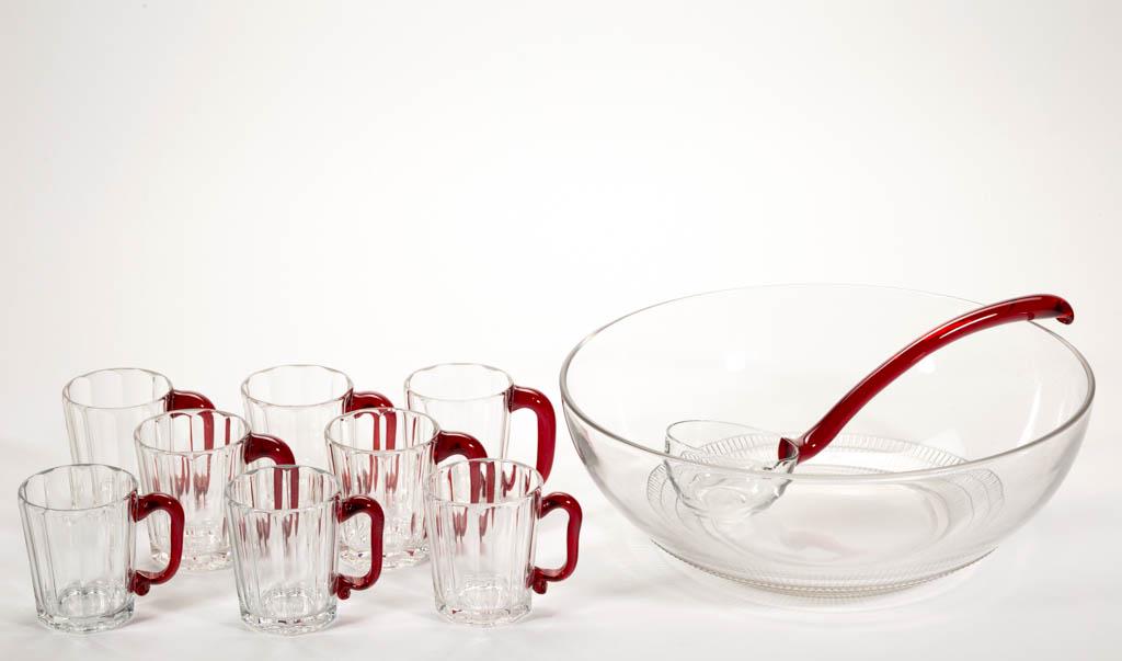 PRESSED DEPRESSION ERA GLASS TEN-PIECE PUNCH SET: PRESSED DEPRESSION ERA GLASS TEN-PIECE PUNCH SET, colorless with cups having ruby handles, comprising a punch bowl, a ladle, and eight cups with factory-polished table rings. Maker unverified. First h