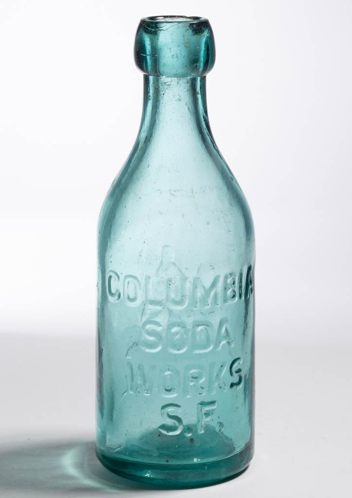 DALL WESTERN SODA BOTTLE: DALL WESTERN SODA BOTTLE, strong greenish aquamarine, shouldered cylindrical form embossed "COLUMBIA / SODA / WORKS / S.F." and seated Liberty figure above "C C DALL", applied blob top, plain slightly