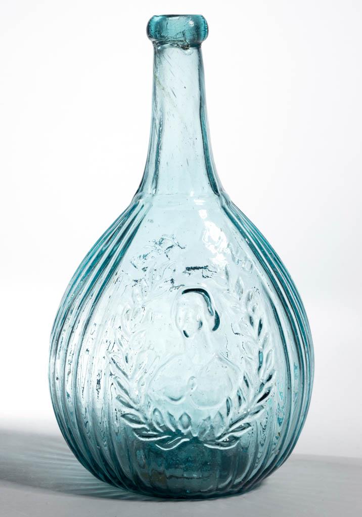 GI-104 JENNY LIND - GLASS FACTORY PORTRAIT CALABASH: GI-104 JENNY LIND - GLASS FACTORY PORTRAIT CALABASH FLASK, strong blue green, quart, obverse embossed "JENY LIND" above portrait, applied rounded mouth, iron pontil mark. Attributed to the Ravenna Gla