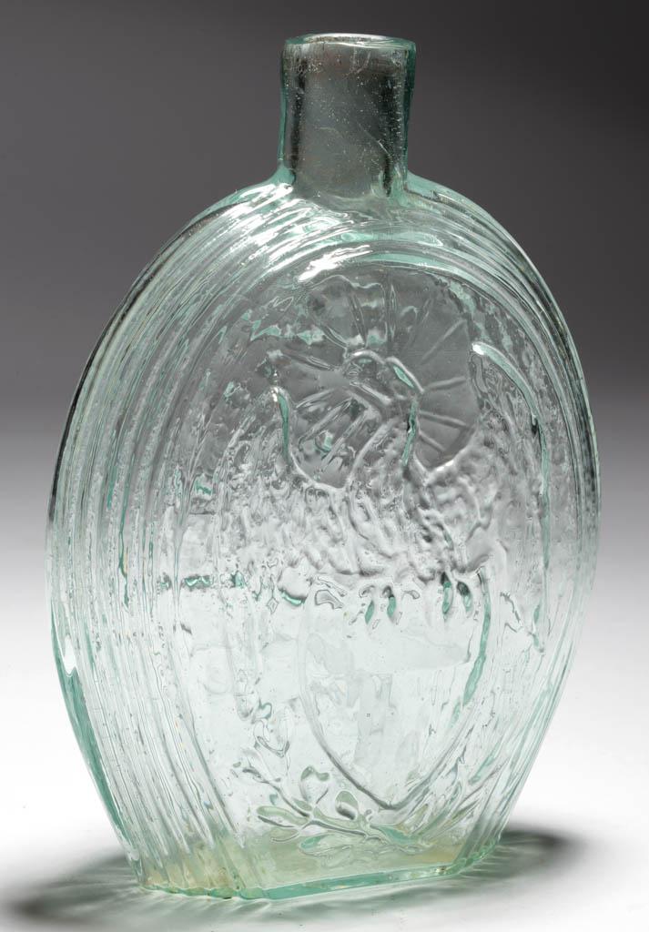 GII-54 EAGLE - FURLED FLAG PICTORIAL / HISTORICAL FLASK: GII-54 EAGLE - FURLED FLAG PICTORIAL / HISTORICAL FLASK, aquamarine with milky striations above base on obverse, pint, reverse embossed "FOR OUR COUNTRY.", plain mouth, rough pontil mark. Attributed t