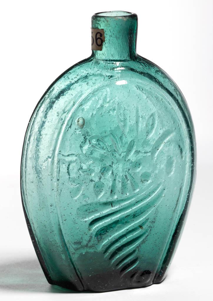 GIII-14 CORNUCOPIA - URN PICTORIAL FLASK: GIII-14 CORNUCOPIA - URN PICTORIAL FLASK, emerald green, half-pint, plain mouth, tubular pontil mark. Lancaster Glass Works, Lancaster, New York. 1850-1860. 5 1/2" H. Undamaged with no wear. Small bub
