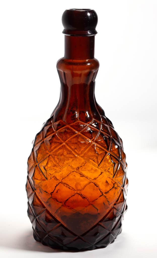 PINEAPPLE FIGURAL (BITTERS) BOTTLE: PINEAPPLE FIGURAL (BITTERS) BOTTLE, medium to dark golden amber, club form with large diamond-shaped plain panel, lobed to cylindrical neck, applied broad, rounded mouth with lower collar, plain base 