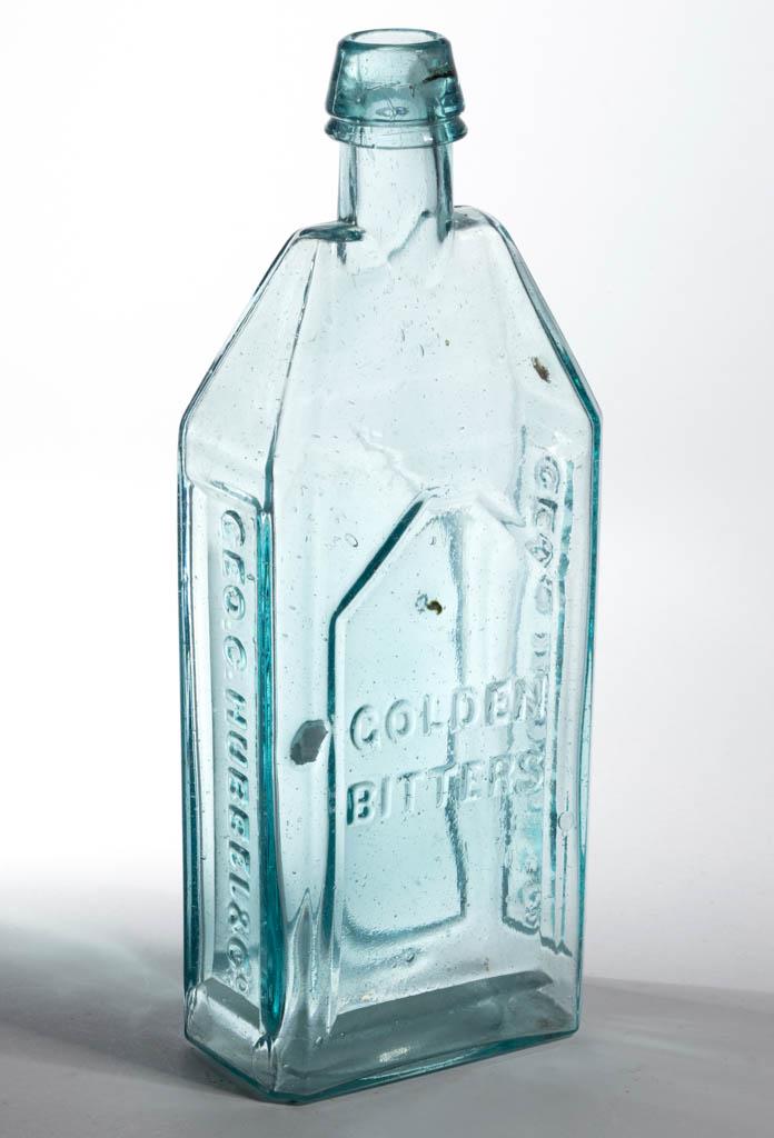 HUBBEL GOLDEN FIGURAL BITTERS BOTTLE: HUBBEL GOLDEN FIGURAL BITTERS BOTTLE, aquamarine, tall rectangular building form with roof, embossed on three sides "GEO. C. HUBBEL & Co - GOLDEN / BITTERS - GEO. C. HUBBEL & Co", applied broad slopin