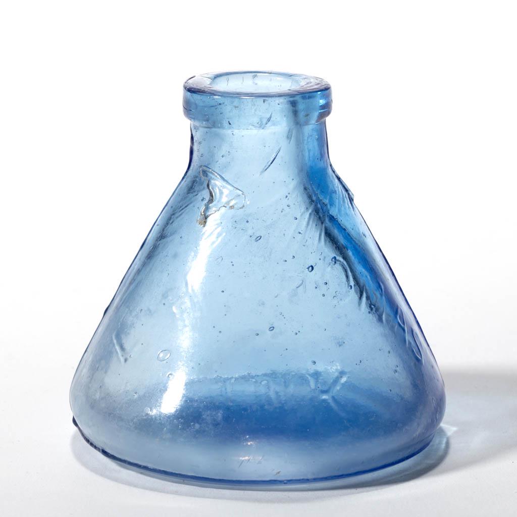 BLOWN-MOLDED THOMAS CONE / CONICAL INK BOTTLE: BLOWN-MOLDED THOMAS CONE / CONICAL INK BOTTLE, light sapphire blue, embossed "L. H. THOMAS / INK" to side, applied squared mouth, plain base. Circa 1870. 2 1/2" H, 2 5/8" D base. Undamaged with some l