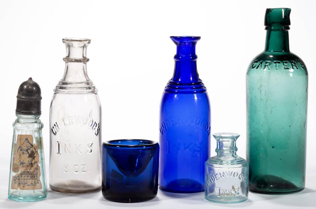 ASSORTED INK AND RELATED BOTTLES / WELLS, LOT OF SIX: ASSORTED INK AND RELATED BOTTLES / WELLS, LOT OF SIX, comprising a strong blue-green Carter's bottle, a cobalt blue cylindrical well, an aquamarine tapered octagonal glue bottle with original top and 